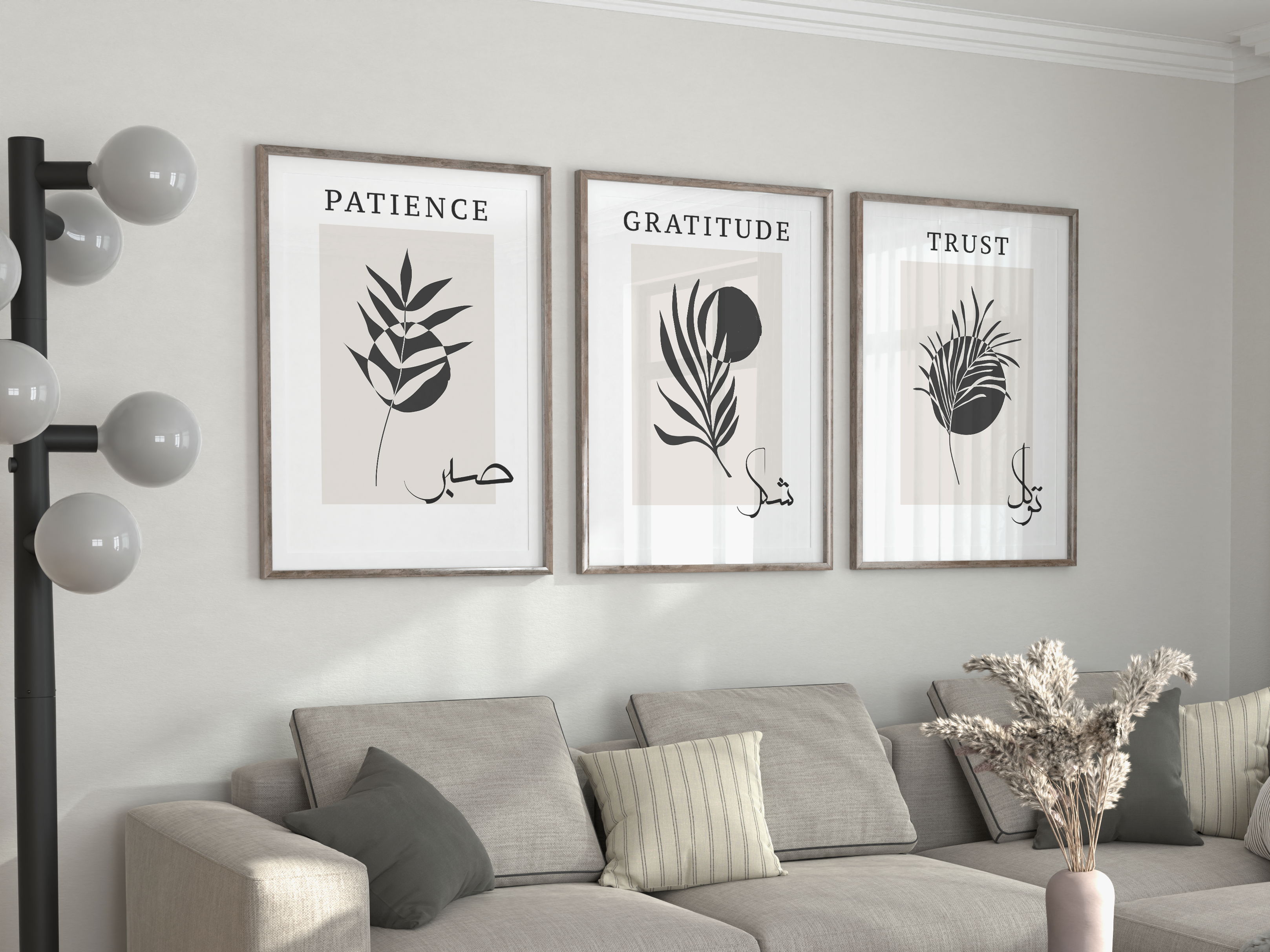 Living room with a gray sectional sofa, decorative pillows, and wall art.